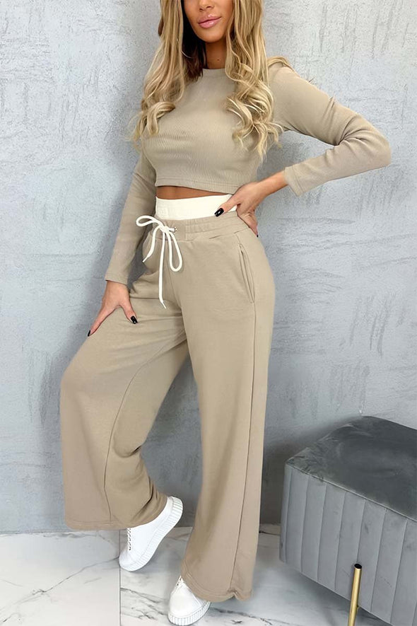 Women's casual tight T-shirt paired with contrasting wide-leg pants suit